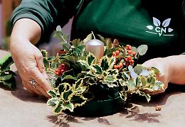 Il centrotavola per le feste: fiori e foglie piene d’amore